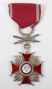 Polish Cross of Merit 2nd Type 2nd Class with Swords: Polish Cross of Merit 2nd Type 2nd Class with Swords, fine example of the silver grade medal made by Spink, London. No damage to the enamel. Complete with its ribbon.