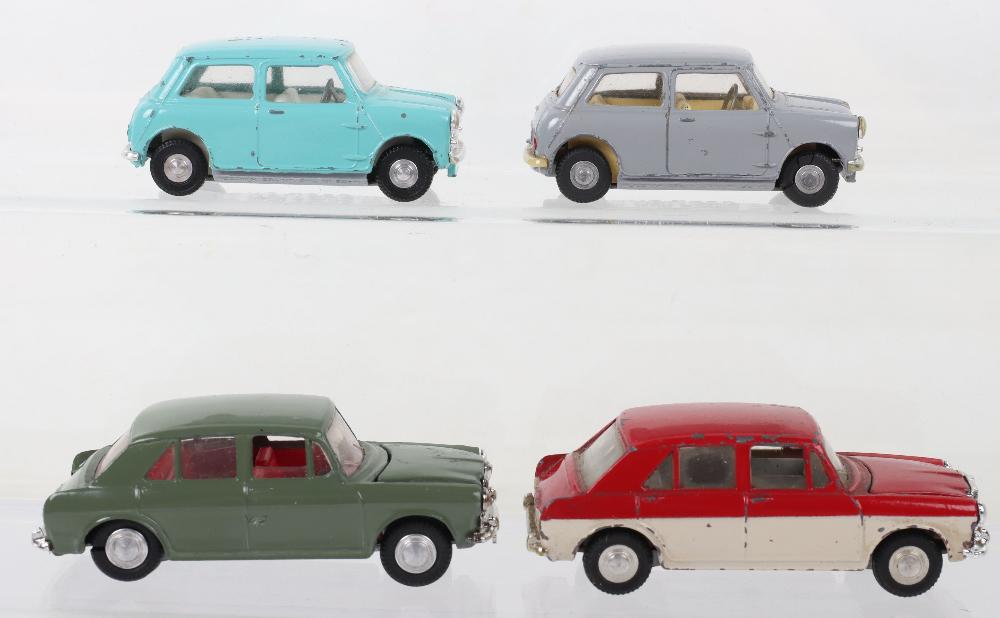 Four unboxed Tri-ang Spot-On Models: Four unboxed Triang Spot-On Models, 211 Austin Seven Mini, light blue body,white interior, 211 Austin Seven Mini, grey body, cream interior, 267 M.G. 1100 red/white, grey seats all in fair to good use