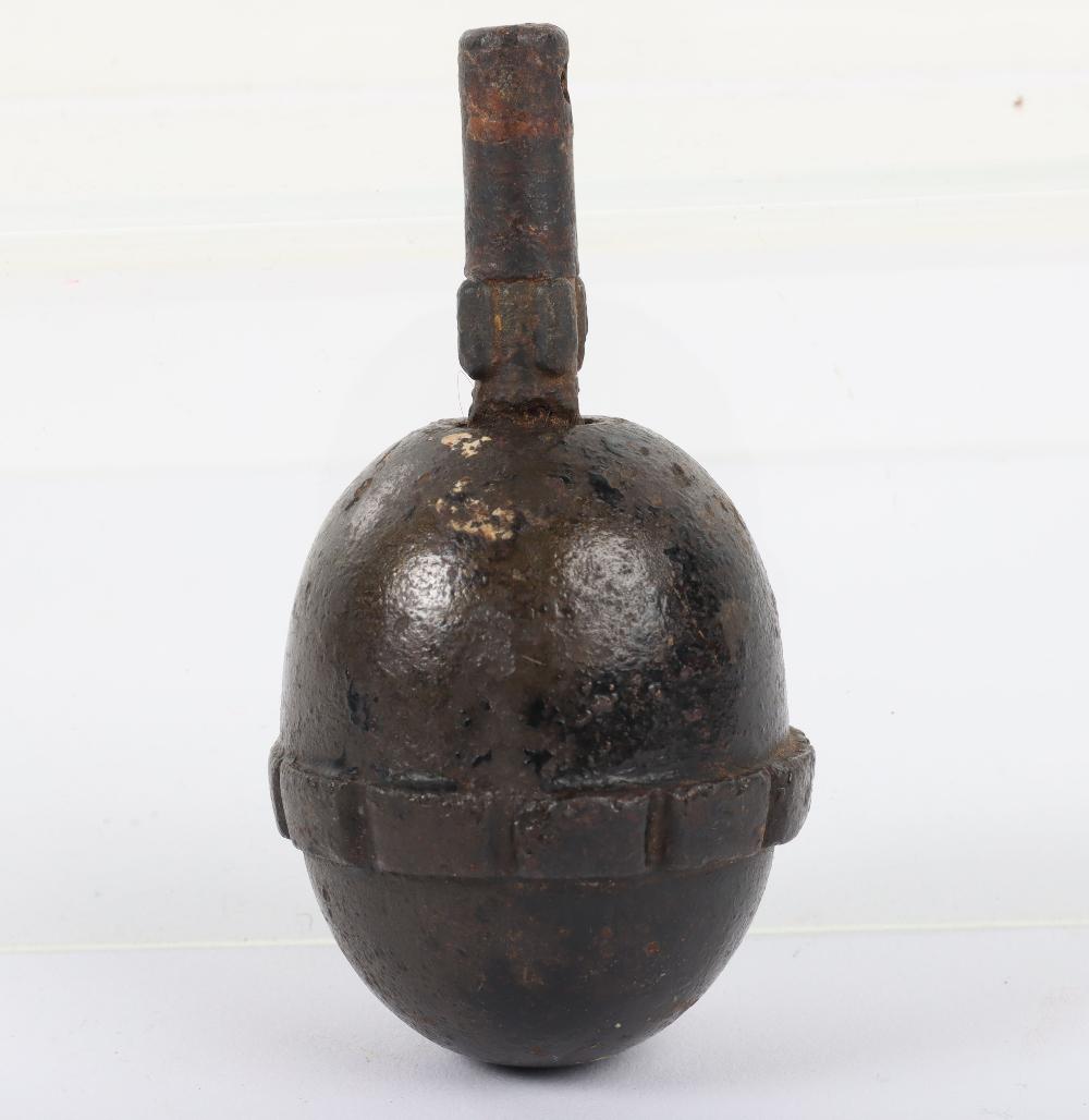 Inert WW1 German Egg Grenade: Inert WW1 German Egg Grenade, good example with black painted body. Complete with the fuse. This lot is inert (Empty and Safe) and legal to own in the UK. We are not able to offer in house post and pa