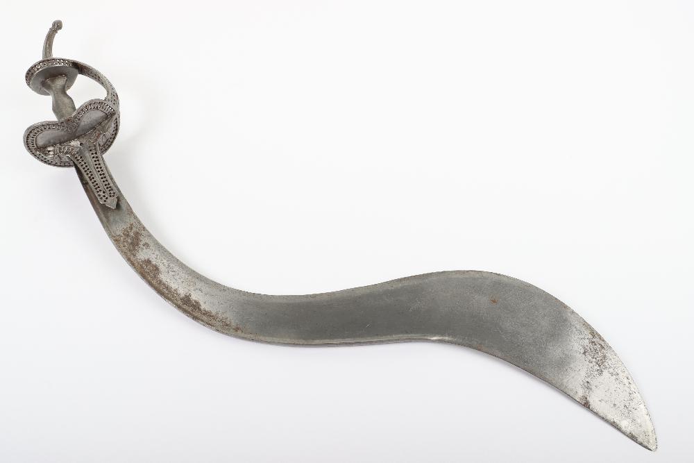 Indian Sword Khanda, 18th Century: Indian Sword Khanda, 18th Century, broad recurved T-section single edge blade with false edge, iron hilt with pierced borders, broad knuckle guard, curved pommel spike. Blade 63.5cms. G