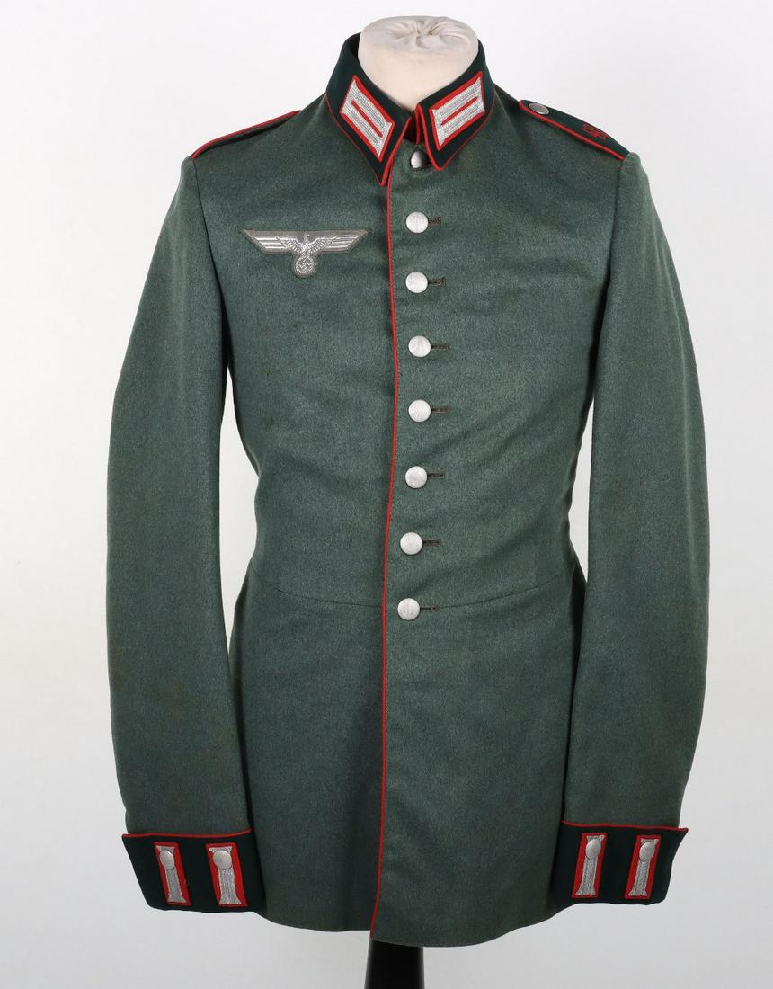 WW2 German Artillery Parade “Waffenrock” Tunic: WW2 German Artillery Parade “Waffenrock” Tunic, near mint condition example of an enlisted ranks waffenrock / parade tunic in fine green wool cloth with flat wire embroidered army breast e