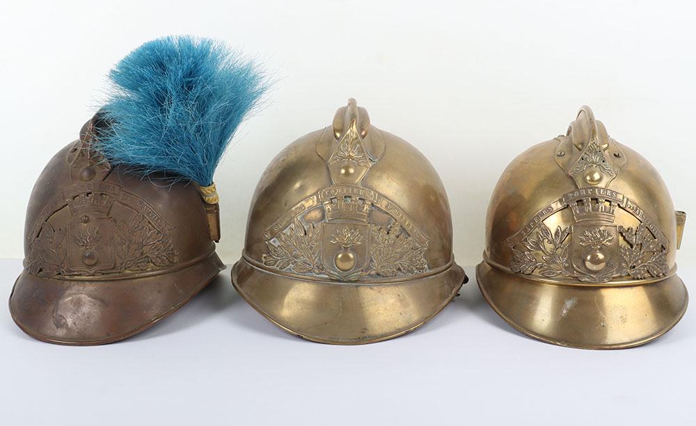 French Brass Fire Helmet: French Brass Fire Helmet, in the Adrian pattern with top comb. Complete with brass helmet plate to the centre, side plume socket. Interior with the original leather liner and leather chinstrap. Genera