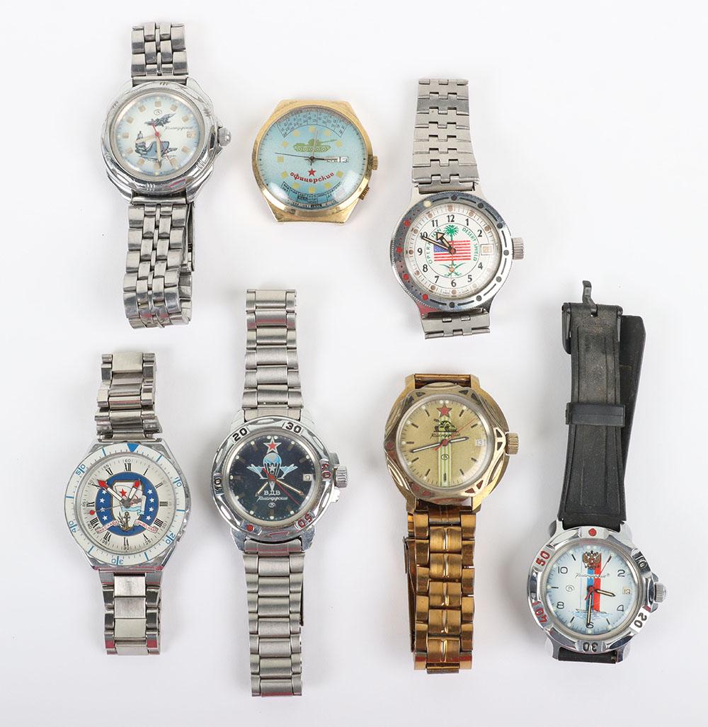 Grouping of Mostly Soviet Russian Military Commemorative Wristwatches: Grouping of Mostly Soviet Russian Military Commemorative Wristwatches, all having military emblems or scenes to the faces. Four with bracelet straps, one rubber strap and one without a strap. None app