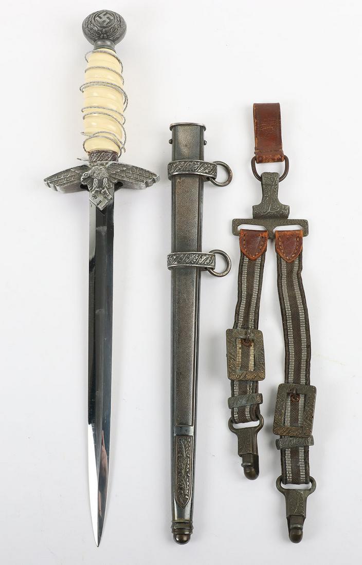 WW2 German Luftwaffe 2nd Pattern Officers Dress Dagger with Deluxe Pattern Hangers by Ernst Pack &: WW2 German Luftwaffe 2nd Pattern Officers Dress Dagger with Deluxe Pattern Hangers by Ernst Pack & Sohne Waffenfabrik, Solingen, white celluloid grip with loose wire binding. Pommel with swastika to t