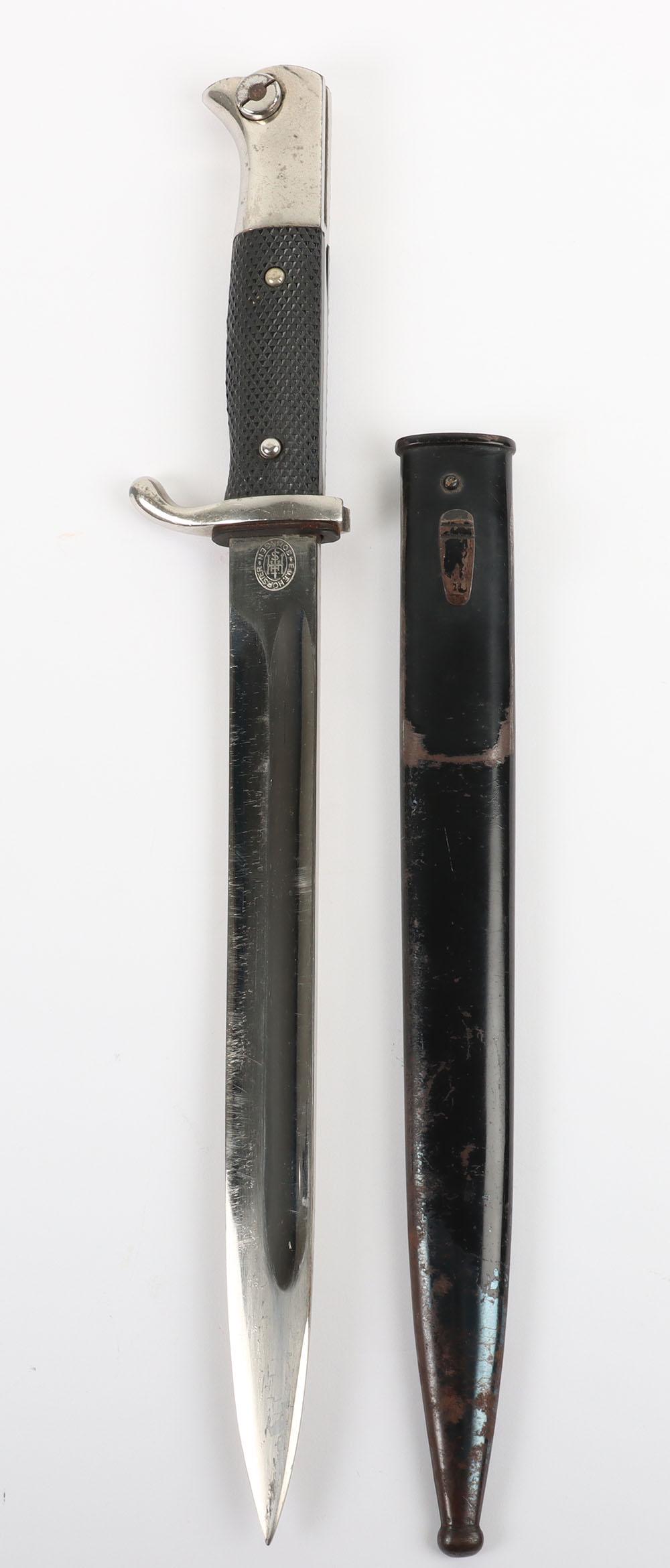 WW2 German Armed Forces Parade Bayonet by E & F Horster Solingen: WW2 German Armed Forces Parade Bayonet by E & F Horster Solingen, two piece chequered grips, plated eagle head pommel and cross guard. Housed in its original blackened scabbard. Plated blade with full