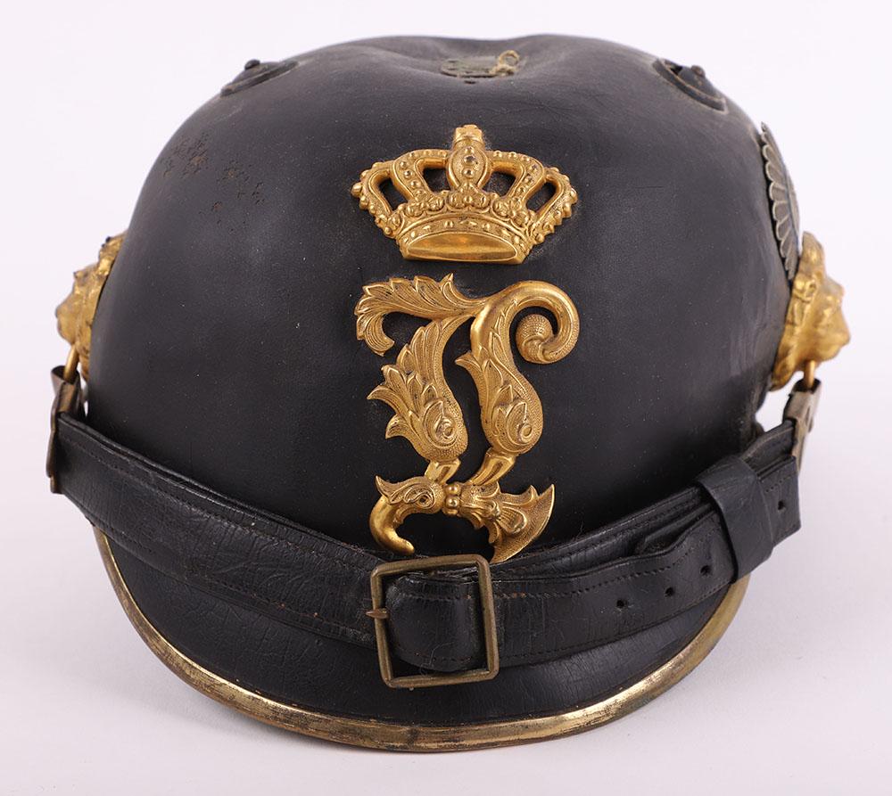 Imperial German Bavarian M-1868 Officers Raupenhelm: Imperial German Bavarian M-1868 Officers Raupenhelm, leather bodied helmet with gilt metal two piece officers helmet plate to the centre, lion head side bosses with special pattern leather chinstrap. 