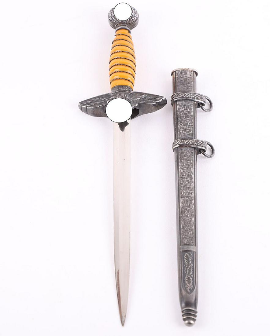 Miniature WW2 German Luftwaffe 2nd Pattern Officers Dress Dagger by Alcoso, Solingen: Miniature WW2 German Luftwaffe 2nd Pattern Officers Dress Dagger by Alcoso, Solingen, being the ¾ size miniature with yellow / orange celluloid grip, pommel with swastika to both sides, cross guard i
