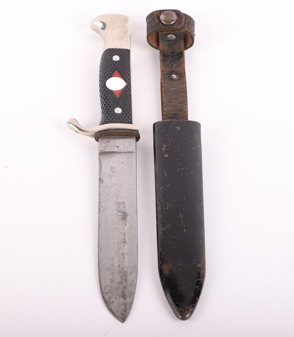 Third Reich Hitler Youth Boys Dagger by Friedrich Herder, Solingen: Third Reich Hitler Youth Boys Dagger by Friedrich Herder, Solingen, two piece black chequered grips with enamel HJ diamond to the centre. Housed in its original blackened scabbard with leather belt lo