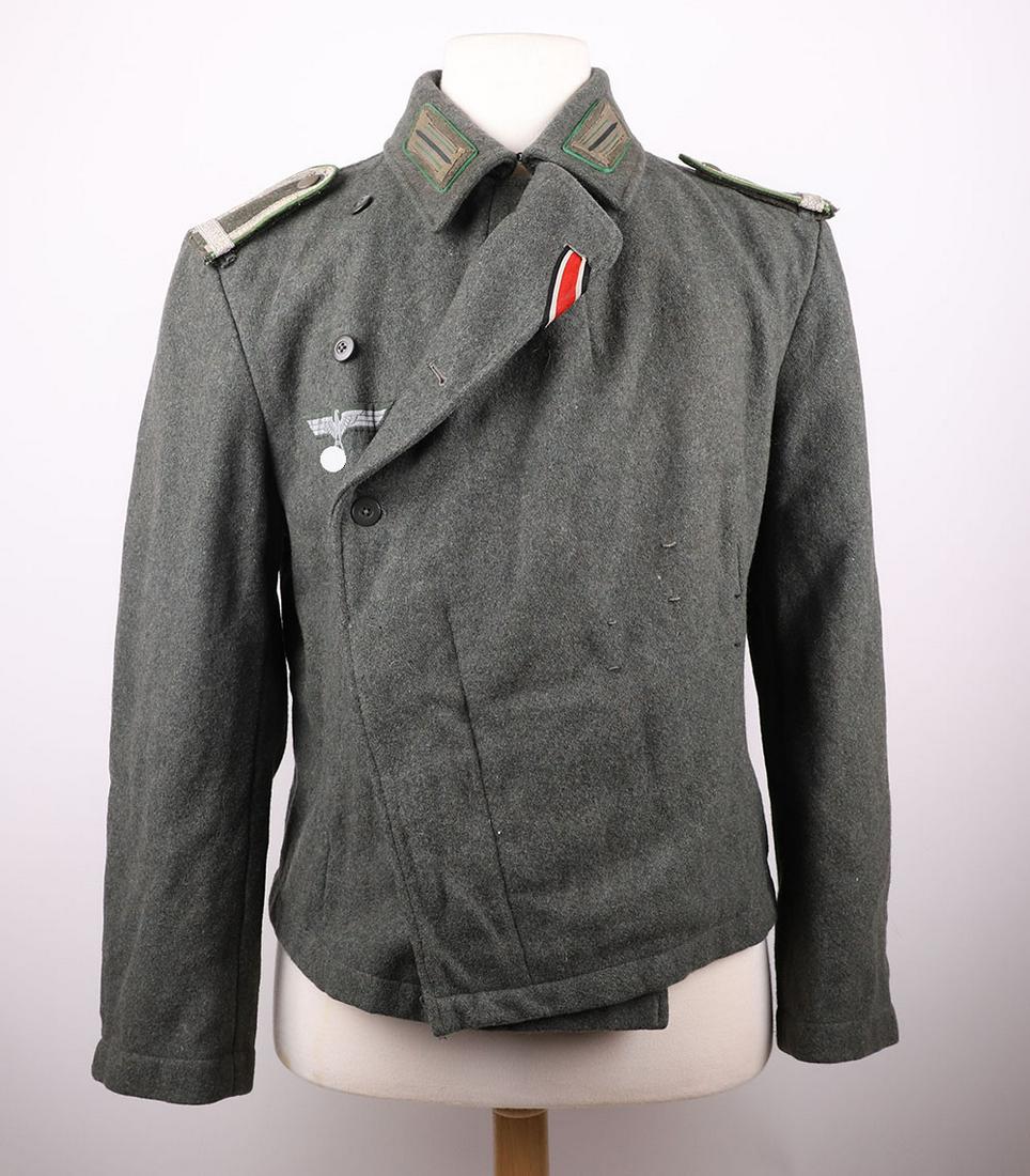 Rare WW2 German Panzer Grenadier Sturgeschutz (Assault Gunners) Wrapover Tunic: Rare WW2 German Panzer Grenadier Sturgeschutz (Assault Gunners) Wrapover Tunic, fine example of the field grey wool wrapover stye tunic with original flat wire NCO’s breast eagle. The collar with or