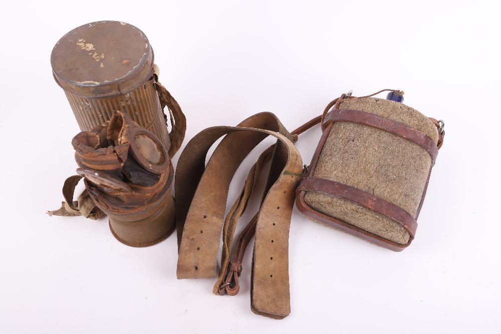 WW1 Equipment Grouping: WW1 Equipment Grouping, consisting of British WW1 period felt covered water bottle / canteen; Australian? Leather brace strap with 1916 date and a Belgium gas mark in its original tin. (3 items)
