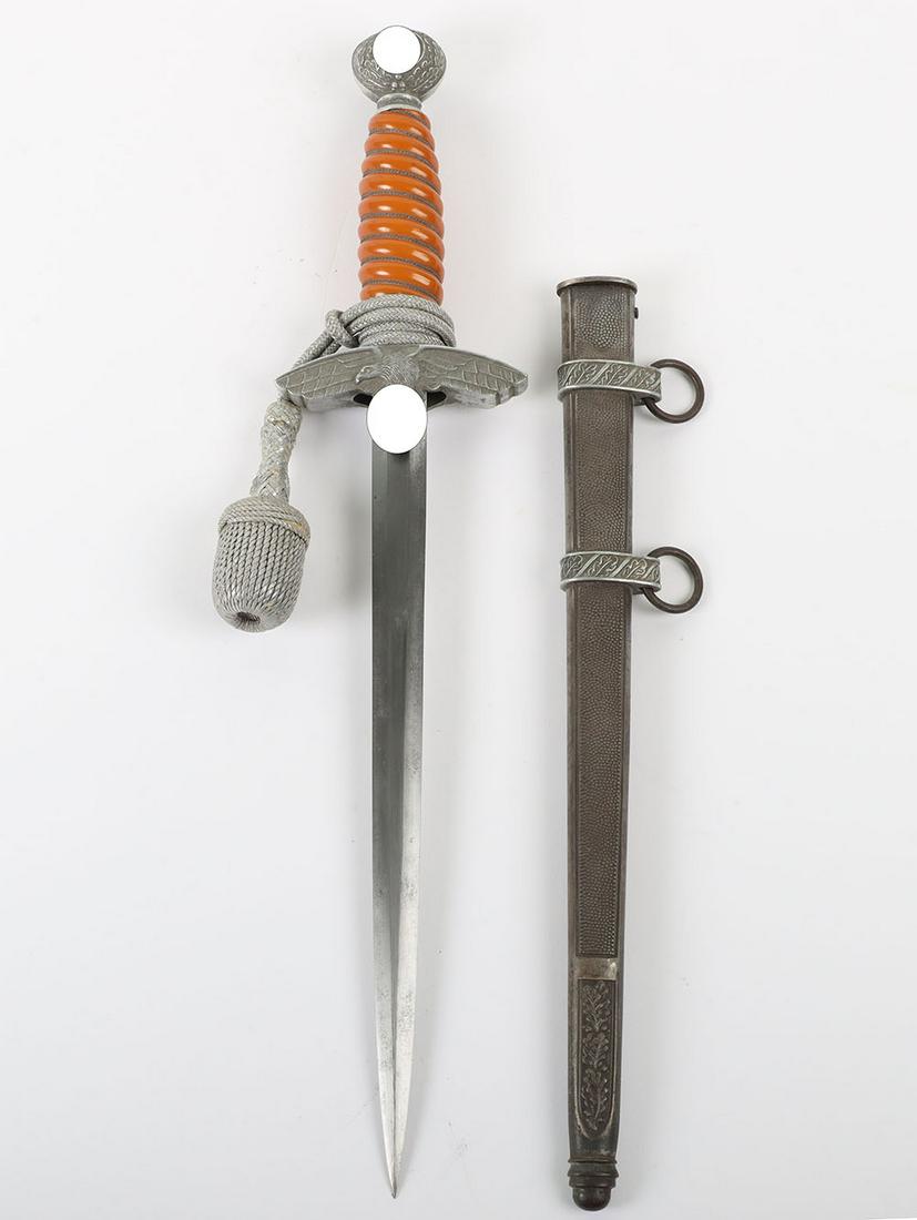 WW2 German 2nd Pattern Luftwaffe Officers Dress Dagger by WKC, Solingen: WW2 German 2nd Pattern Luftwaffe Officers Dress Dagger by WKC, Solingen, good example with deep orange celluloid grip retaining the original wire binding. Pommel with swastika to both sides. Cross gua