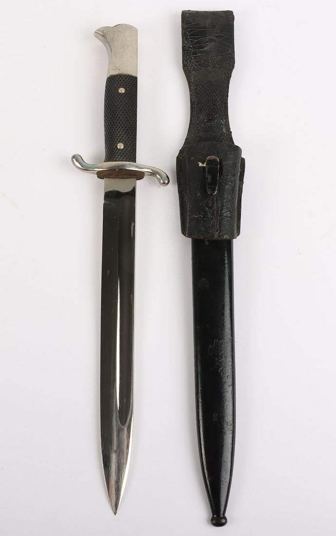 Third Reich Fire Brigade Parade Bayonet: Third Reich Fire Brigade Parade Bayonet, wit two piece chequered grips, plated pommel and ‘S’ type cross guard. Housed in its original scabbard with black leather bayonet frog attached. Polished p