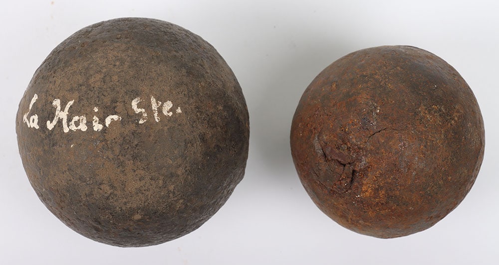 Battle of Waterloo Battlefield Excavated Cannon Ball: Battle of Waterloo Battlefield Excavated Cannon Ball, relic small heavy iron cannon ball in as found condition. Accompanied by another larger cannon ball which is painted in white ‘La Haie Ste.’ B