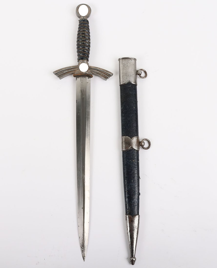 Third Reich Luftwaffe Officers 1st Pattern Dress Dagger: Third Reich Luftwaffe Officers 1st Pattern Dress Dagger, with blue leather covering to the grip and original wire binding. Pommel with mobile swastika to both sides, cross guard in winged form with mo