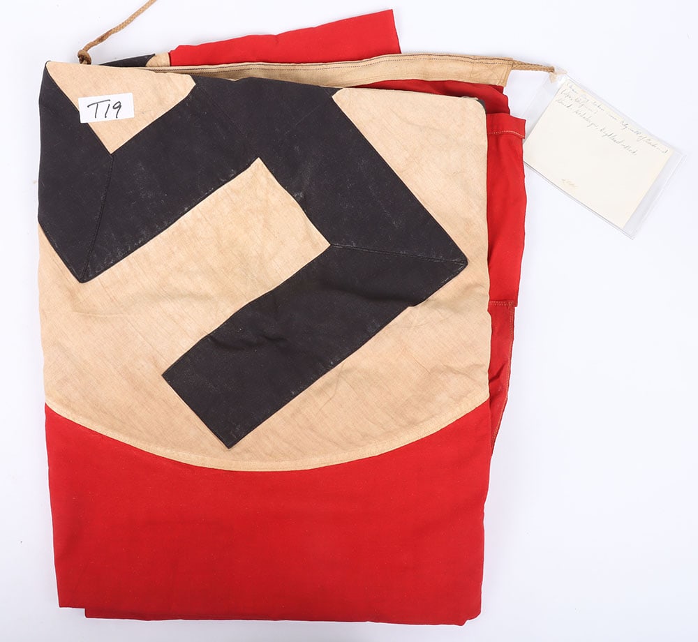 WW2 German NSDAP Flag Taken by US GI from the Town Hall in Spa, Belgium in 1944: WW2 German NSDAP Flag Taken by US GI from the Town Hall in Spa, Belgium in 1944, large red cotton NSDAP swastika party flag with multipiece swastika to the centre. Attached to the enforced taped edge 