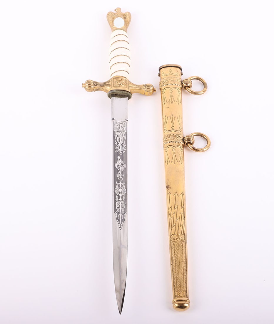 WW2 GERMAN KRIEGSMARINE OFFICERS DRESS DAGGER: WW2 GERMAN KRIEGSMARINE OFFICERS DRESS DAGGER, fine example with gilt metal top eagle pommel, white celluloid grip with wire binding and cross guard with press button release. Housed in its original s
