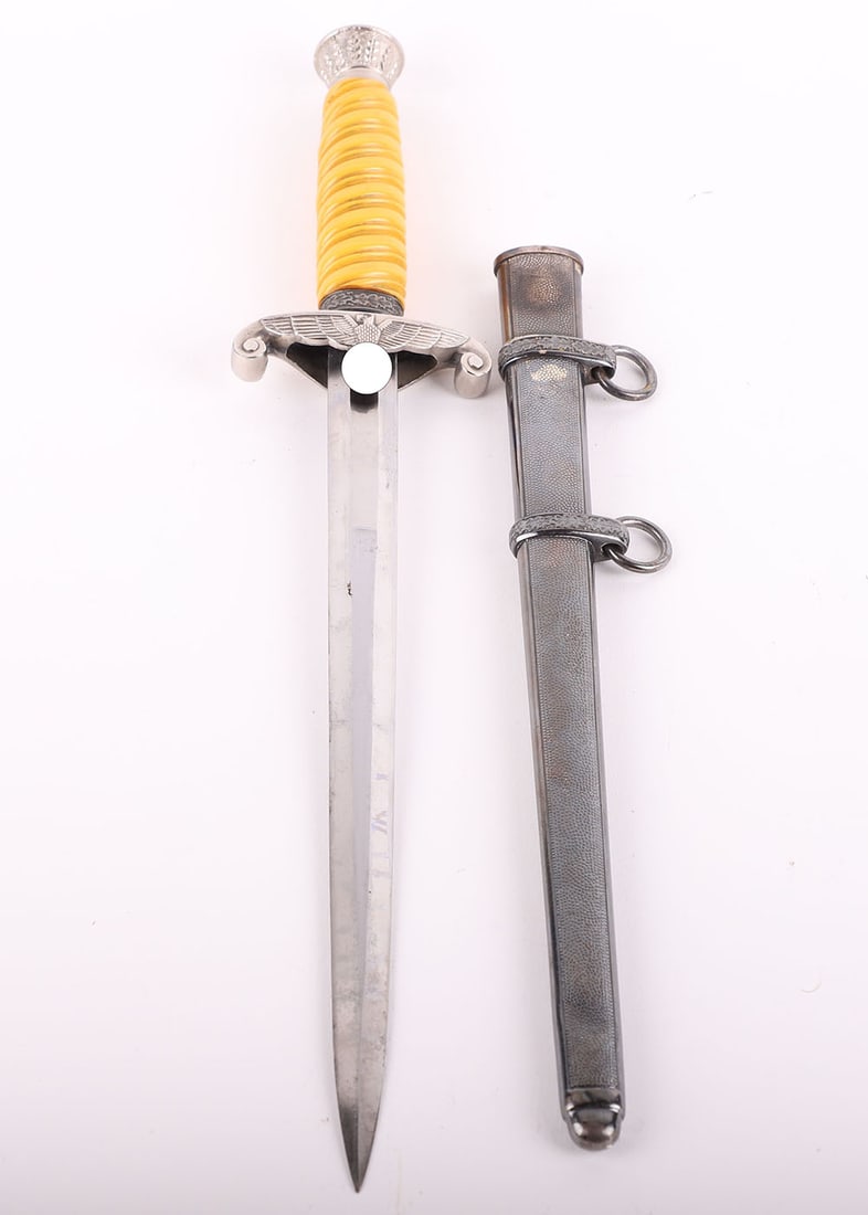 WW2 GERMAN ARMY OFFICERS DRESS DAGGER BY CARL EICKHORN, SOLINGEN: WW2 GERMAN ARMY OFFICERS DRESS DAGGER BY CARL EICKHORN, SOLINGEN, with yellow celluloid grip, pommel and cross guard appear to have been plated at some time. Housed in its original scabbard with a dar