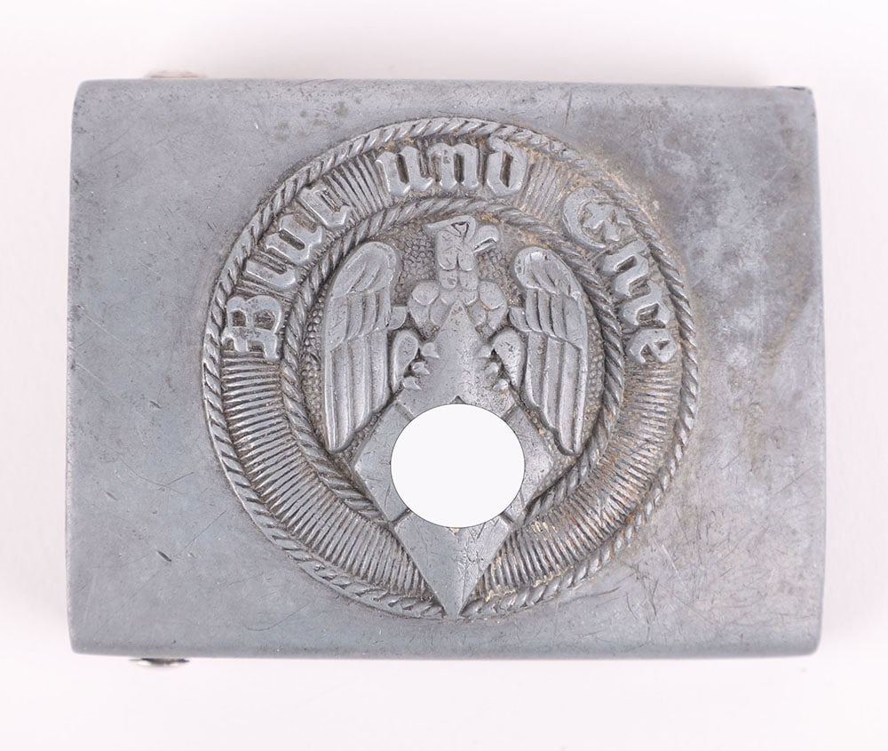 THIRD REICH HITLER YOUTH BELT BUCKLE: THIRD REICH HITLER YOUTH BELT BUCKLE, good example of a nickel silver boys buckle with fittings to the reverse. Buckle with stylised ?A? maker mark for Assmann & Sohn, GES GESCH and RZM logo with 17 u