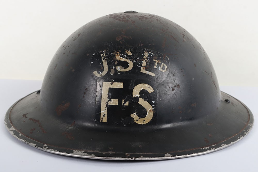 WW2 British Home Front Factory Fire Service Steel Helmet: WW2 British Home Front Factory Fire Service Steel Helmet, standard WW2 British steel helmet with black paint finish to the shell. White stencilled factory details ?J. S. Ltd F.S? to the front. Helmet