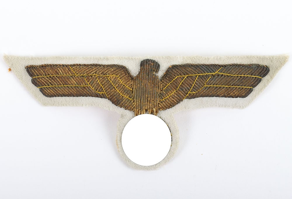 Scarce German Naval (Kriegsmarine) Officers Tunic Breast Eagle: Scarce German Naval (Kriegsmarine) Officers Tunic Breast Eagle, golden wire embroidered eagle on white wool backing. Very good condition. Also possibly worn on the army general summer uniform.