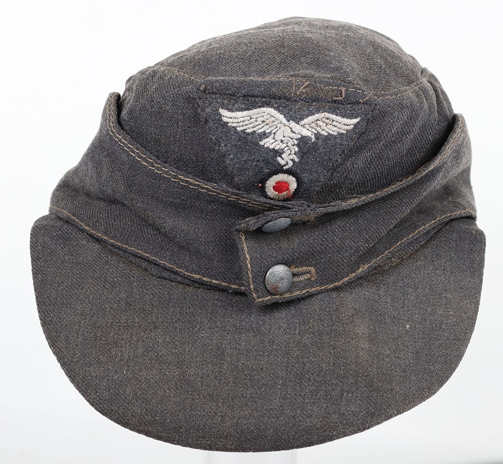 WW2 German Luftwaffe M-43 Field Cap ?Einheitsfeldm?tze?: WW2 German Luftwaffe M-43 Field Cap ?Einheitsfeldm?tze?, Light blue ?Gabardine? so called ?Italian wool? two button constructed cap. Original and hand applied wool Luftwaffe trapezoid. Interior in goo