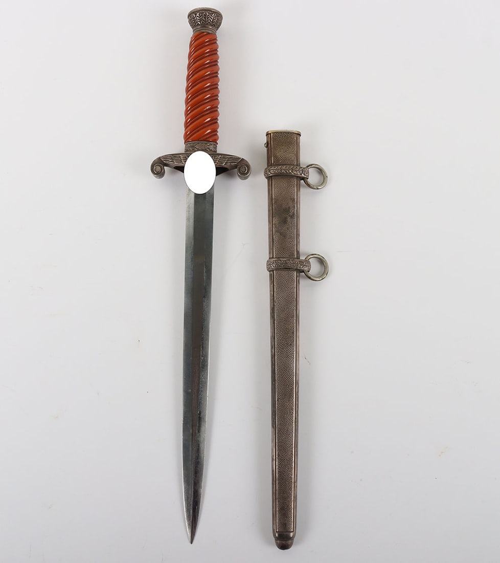 WW2 German Army Officers Dagger by Ernst Pack & Sohne with Personalised Initials to the Cross Guard: WW2 German Army Officers Dagger by Ernst Pack & Sohne with Personalised Initials to the Cross Guard, fine untouched example with dark patina to the exterior fittings. Fine deep orange celluloid grip.