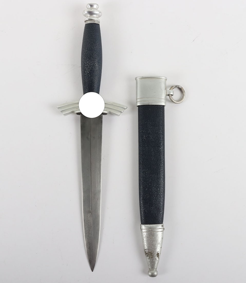 Third Reich NSFK Flyers Knife Dagger by F&A Helbig: Third Reich NSFK Flyers Knife Dagger by F&A Helbig, good example with aluminium fittings and blue leather covering to the grip and scabbard. Black enamel to the central swastikas. One screw missing fr
