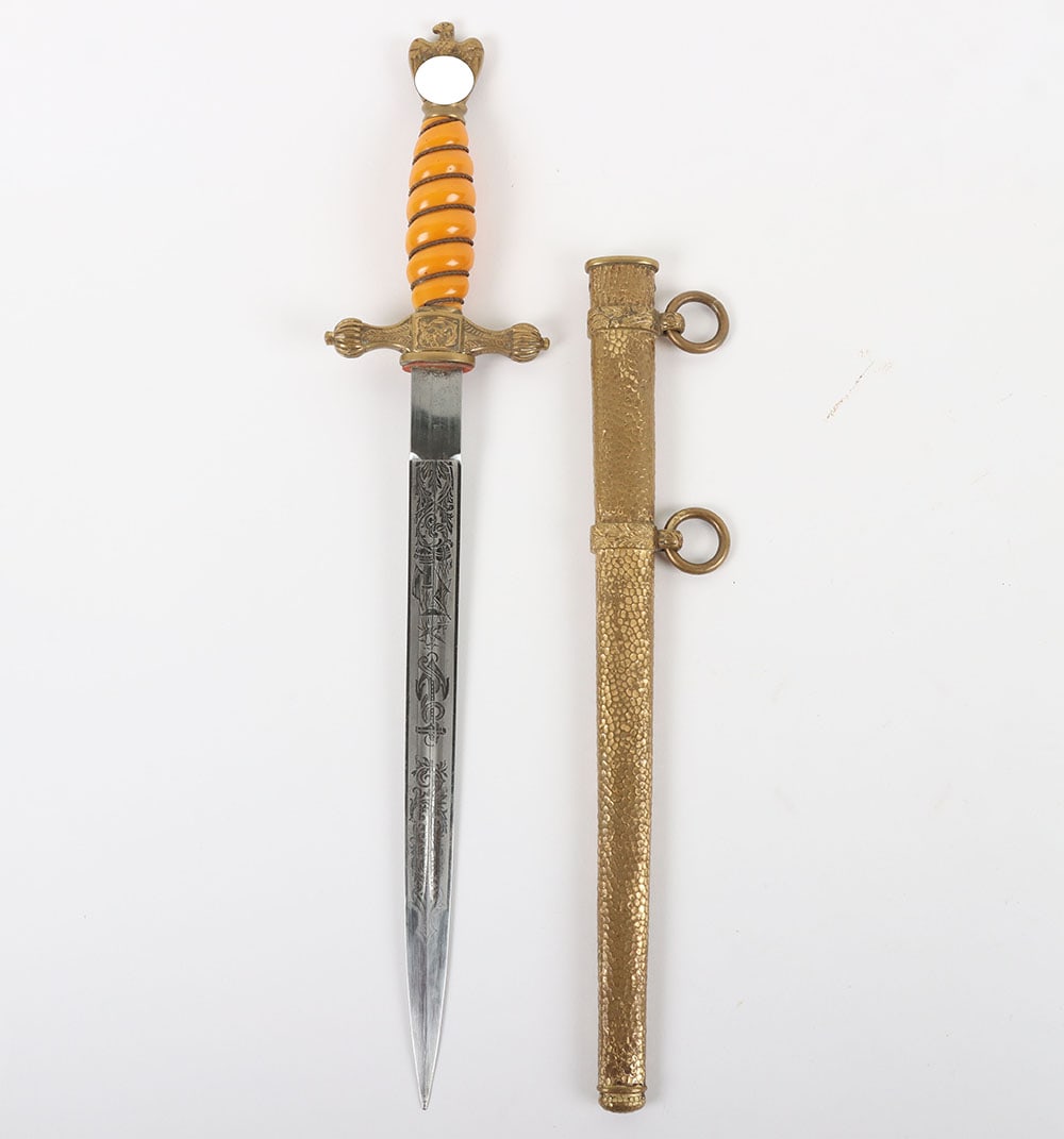 WW2 German Kriegsmarine Officers Dress Dagger by F W Holler, Solingen: WW2 German Kriegsmarine Officers Dress Dagger by F W Holler, Solingen, fine example with orange celluloid grip having the original wire binding. Gilt eagle pommel top and cross guard with fouled ancho