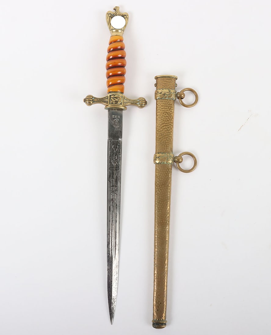 WW2 German Kriegsmarine Officers Dress Dagger by WKC: WW2 German Kriegsmarine Officers Dress Dagger by WKC, good orange grip example with the original wire binding. Polished brass eagle pommel top and cross guard with fouled anchor having press stud to t