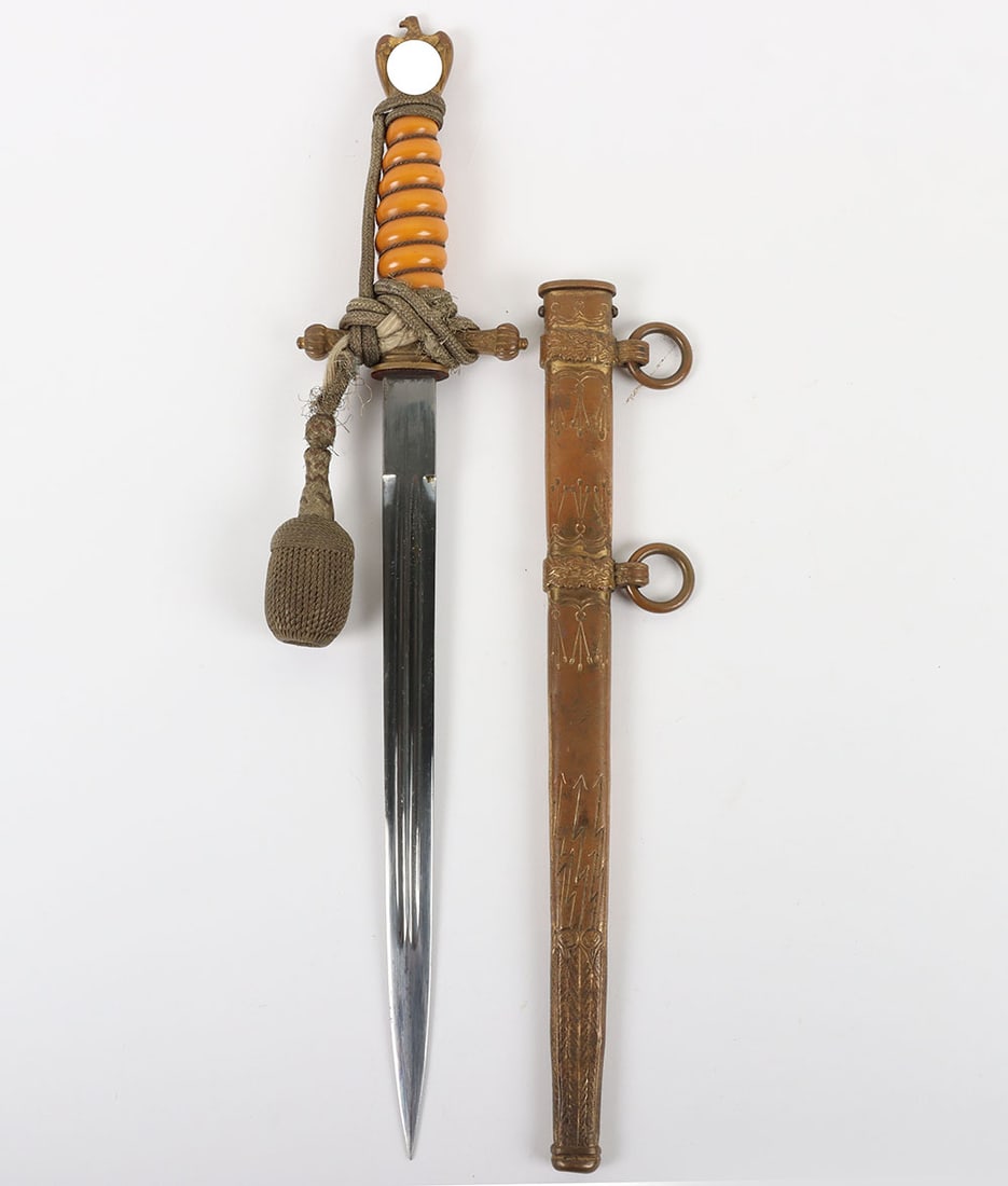 WW2 German Kriegsmarine Officers Dress Dagger by Alcoso, Solingen: WW2 German Kriegsmarine Officers Dress Dagger by Alcoso, Solingen, good untouched example with an orange celluloid grip having wire binding, eagle pommel top and cross guard with the button top now ab