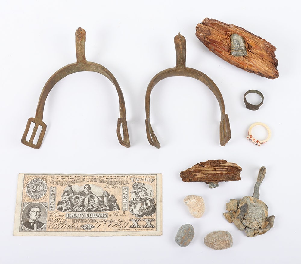 US CIVIL WAR RELIC LOT: US CIVIL WAR RELIC LOT, 10 ITEMS, a pr. of spurs dug at Chickamauga, remnants of a arrow back buckle, 3 shot minnie balls, 2 minnie balls embedded in tree wood ( 1 is a 577. CS example from Bentonvill