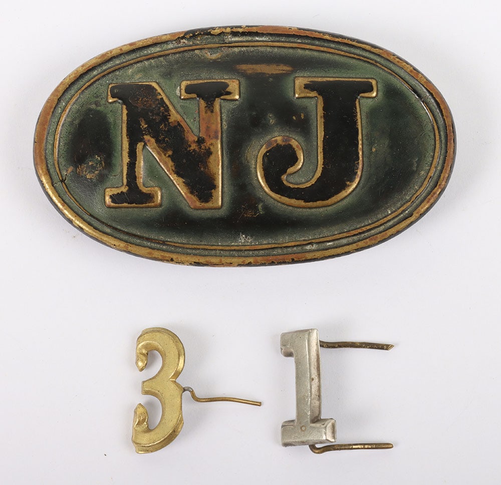 US CIVIL WAR NEW JERSEY STATE BELT BUCKLE, SCARCE SMALL SIZE,: US CIVIL WAR NEW JERSEY STATE BELT BUCKLE, SCARCE SMALL SIZE, a brass oval just under 2 ?? x 1 ??, ?N J? design & lead filled w/ a brass arrow hook & single brass prong, has a dark patina, comes with 