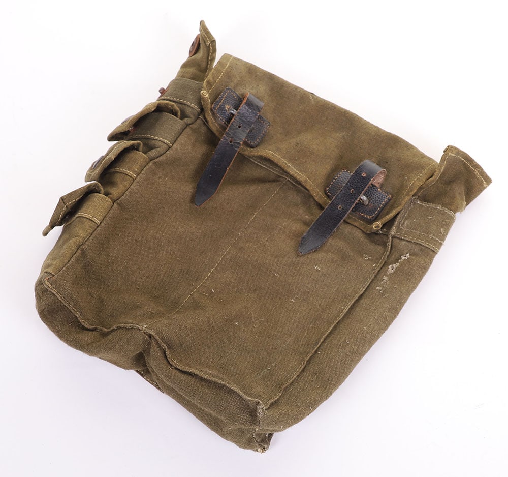WW2 GERMAN WEHRMACHT PIONEER BAG FOR 2 1 KG CHARGES & 4 AMMO CLIPS: WW2 GERMAN WEHRMACHT PIONEER BAG FOR 2 1 KG CHARGES & 4 AMMO CLIPS, OD canvas, w/ OD web & black leather trim, 9? x 3 ?? x 8?, has a few repairs & small holes, no visible markings,