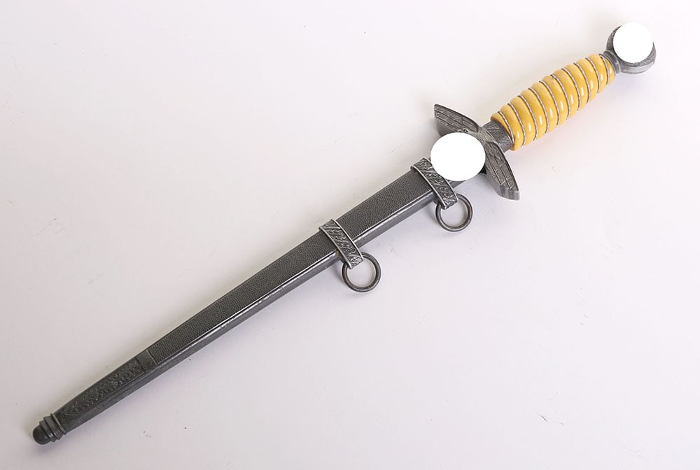 WW2 GERMAN LUFTWAFFE 2ND MODEL OFFICERS DRESS DAGGER BY WKC: WW2 GERMAN LUFTWAFFE 2ND MODEL OFFICERS DRESS DAGGER BY WKC, yellow celluloid grip with wire binding still intact. Pommel with dark gilding to the swastikas on both sides. Nice quality cross guard. Bl