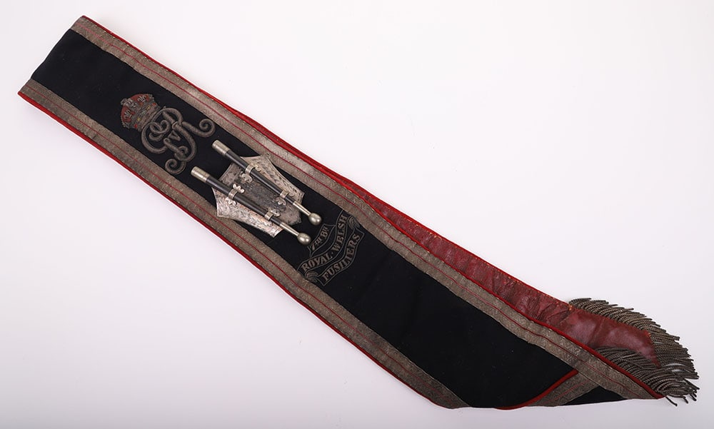 7TH BATTALION ROYAL WELSH FUSILIERS DRUM MAJORS SASH: 7TH BATTALION ROYAL WELSH FUSILIERS DRUM MAJORS SASH, fine example of a George V period black cloth sash with bullion embroidered George V cipher above silver plated shield supporting two miniature dr