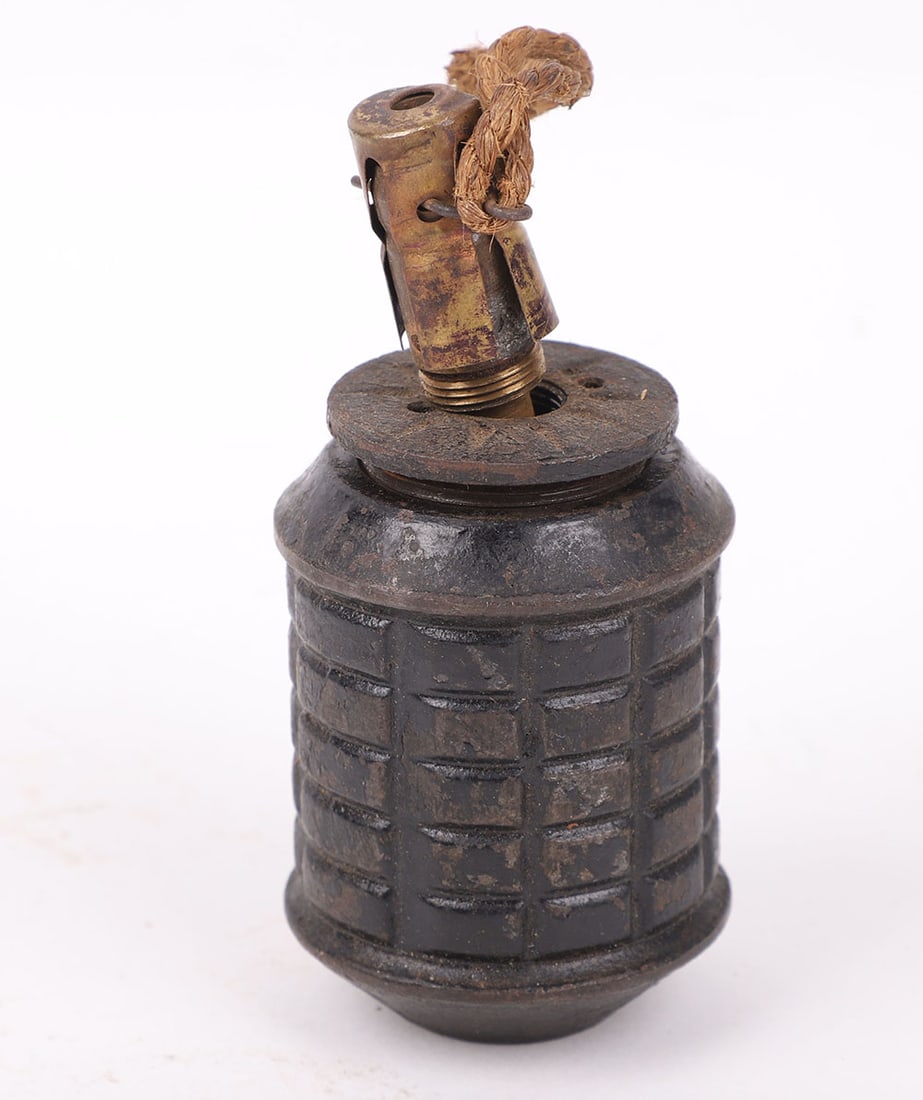 INERT WW2 JAPANESE TYPE 97 FRAGMENTATION GRENADE: INERT WW2 JAPANESE TYPE 97 FRAGMENTATION GRENADE, with black painted body, complete with brass fuse. Empty and safe. PLEASE NOTE ONLY SUITABLE FOR SALES IN USA.