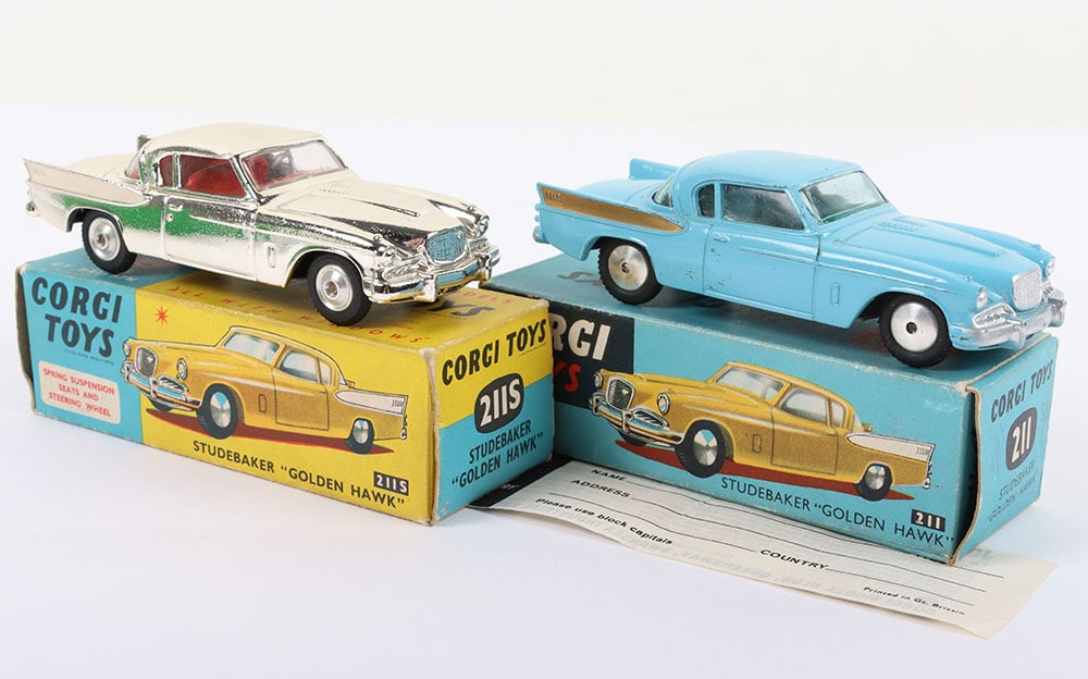 Two Boxed Vintage Corgi 211 Studebaker Golden Hawks: Two Boxed Vintage Corgi 211 Studebaker Golden Hawks, 211 blue body, gold rear wing flashes, flat spun wheels, blue tinted screen, in near mint original condition, early blue picture box is very good,