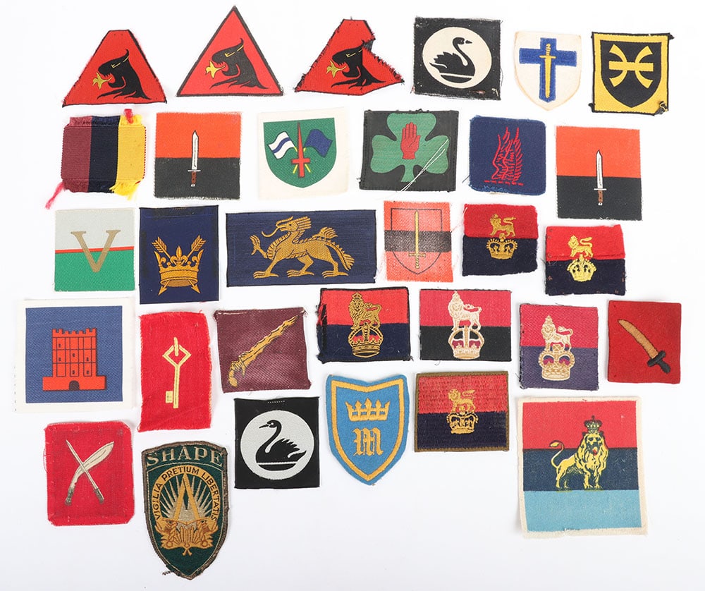 Quantity of British Army Formation signs: Quantity of British Army Formation signs. Lot includes examples of printed, embroidered & silk badges. Lot includes Intelligence & Security Group Vols, Supreme Headquarters Allied Powers Europe, Briti