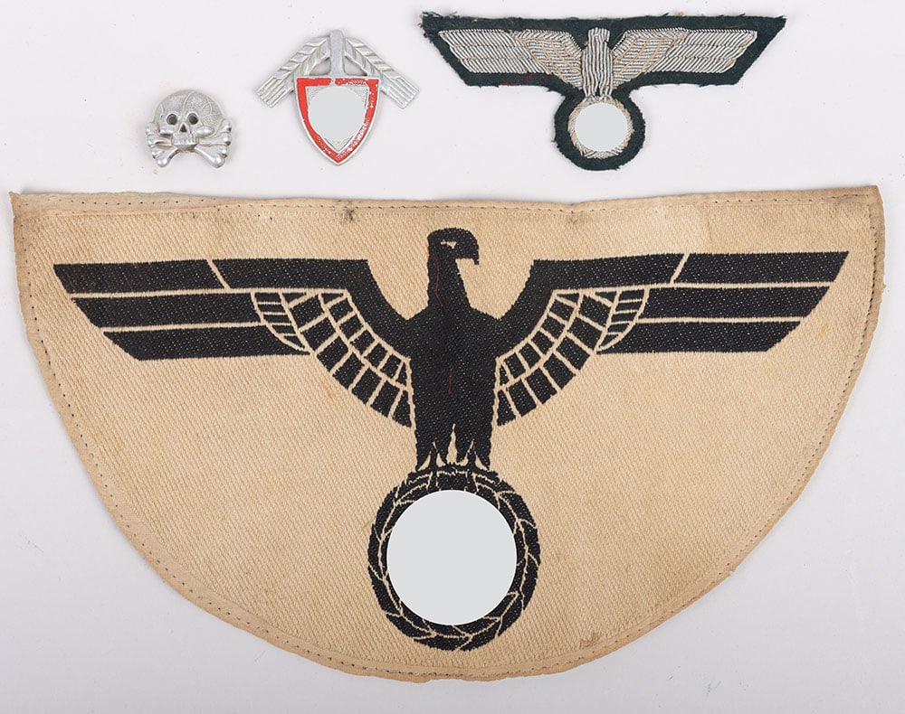 Mixed lot with Third Reich German insignia.: Mixed lot with Third Reich German insignia. Sports breast eagle, RAD cap badge, one aluminum panzer collar tab skull and an officer breast eagle. Many of them with signs of age and/or damage.
