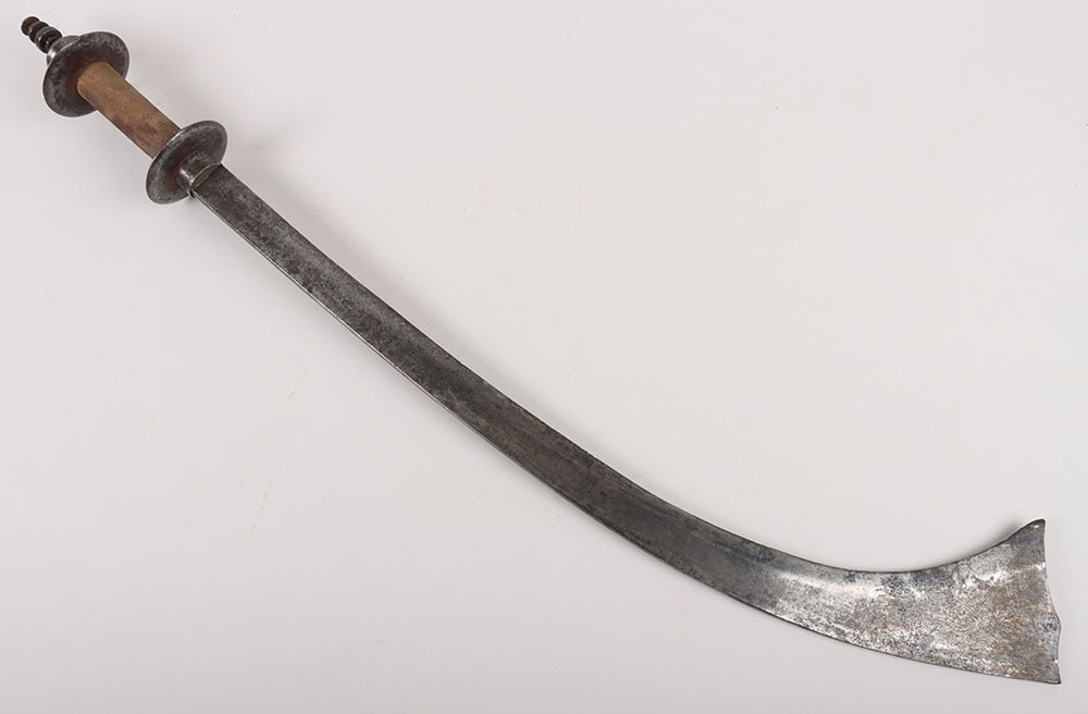 Nepalese Sword kora, 18th/19th Century: Nepalese Sword kora, 18 th /19 th Century , single edge blade 57cms swelling to an ‘elephant’s ear’ tip and with traces of engraved decoration, double disc hilt with fabric-covered grip and stup