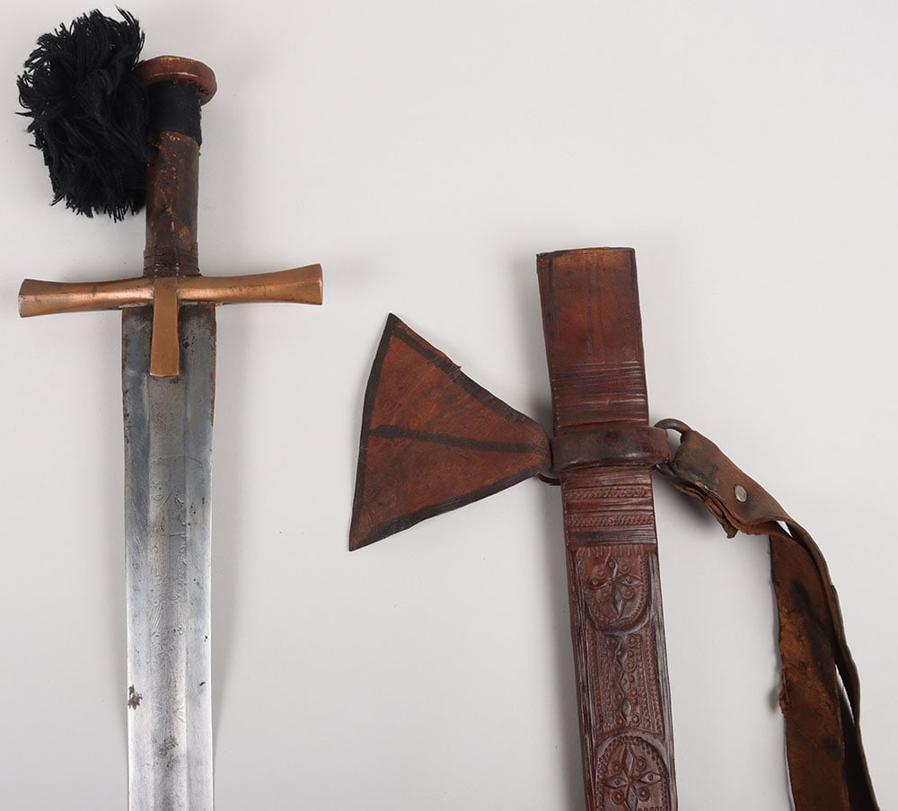 Slightly Unusual Sudanese Mahdist Period Sword Kaskara: Slightly Unusual Sudanese Mahdist Period Sword Kaskara , broad straight double edge blade 83cms etched with assorted representations of suns and moons, copper crosspiece of conventional form, leather-