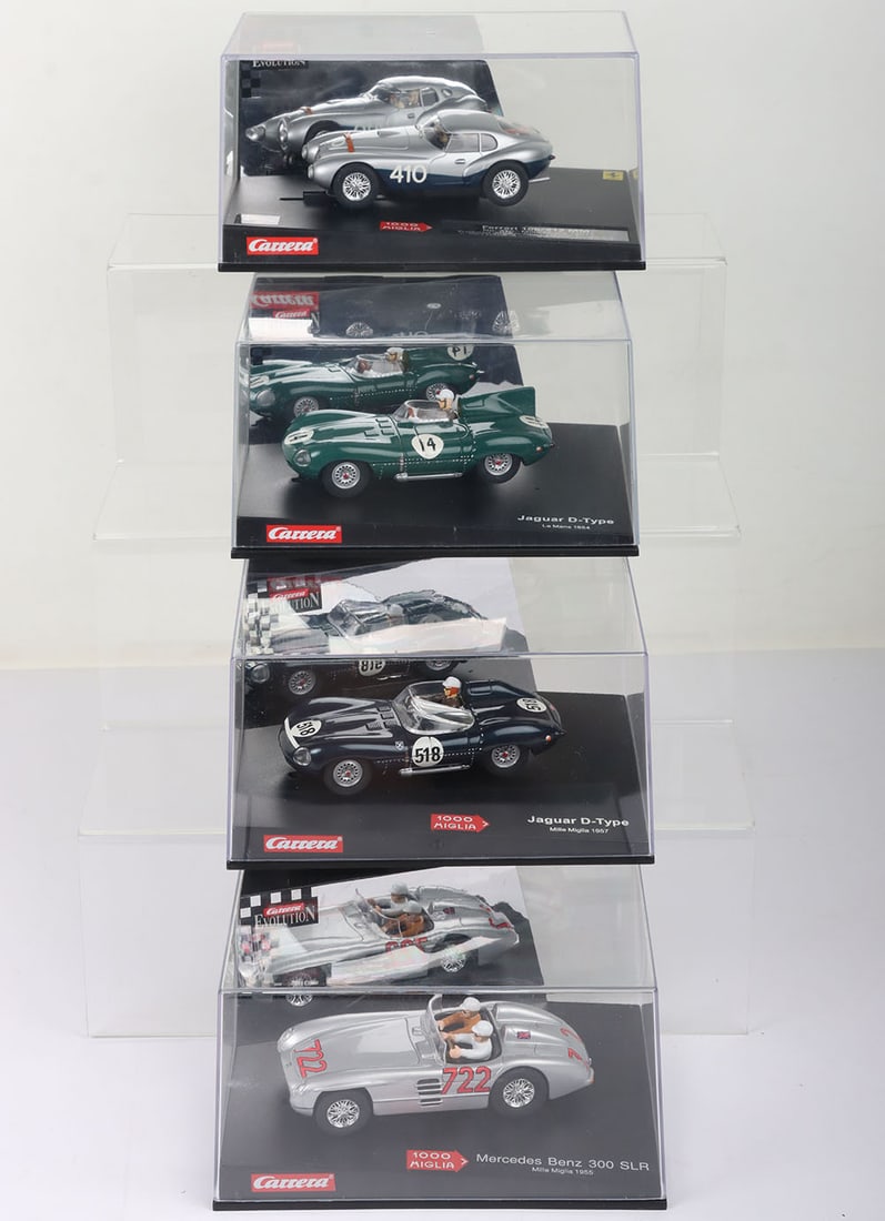 Four boxed Carrera Evolution slot cars, (1 of 2)