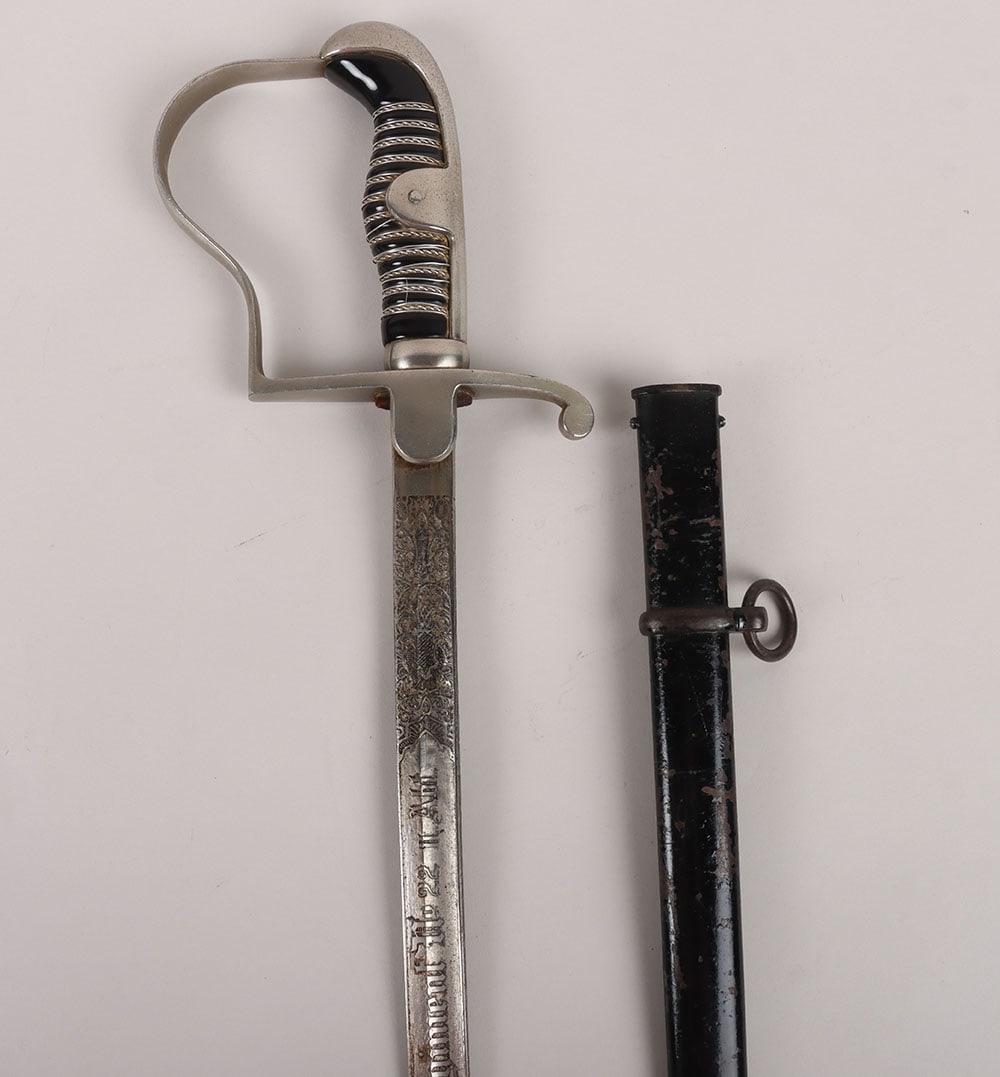 WW2 German Artillery Regiment Nr22 Tripple Etched Sword by Carl Eickhorn, Solingen: WW2 German Artillery Regiment Nr22 Tripple Etched Sword by Carl Eickhorn, Solingen, being an other ranks dove head pattern with the wire binding still intact. Housed in the original scabbard with sing
