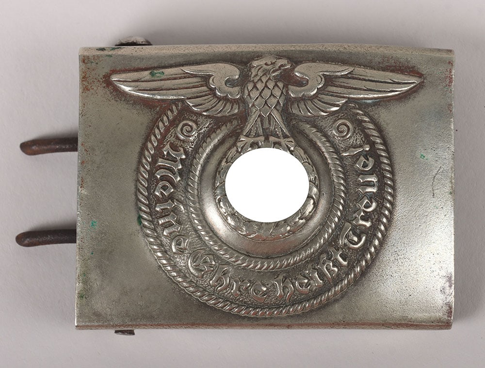 WW2 German Waffen-SS Belt Buckle by Overhoff & Cie: WW2 German Waffen-SS Belt Buckle by Overhoff & Cie, early nickel silver construction. Maker marked on the reverse “O&C” and “Ges. Gesch.”. Worn but good condition.