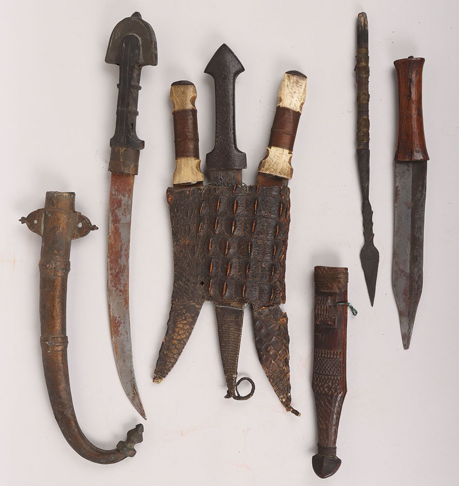 ^ African Sudanese Tribal Dagger: ^ African Sudanese Tribal Dagger, interesting steel dagger with two bone hilted daggers, housed in crocodile skin three part sheath. Blades all etched with pattern decoration. Various conditions; wood