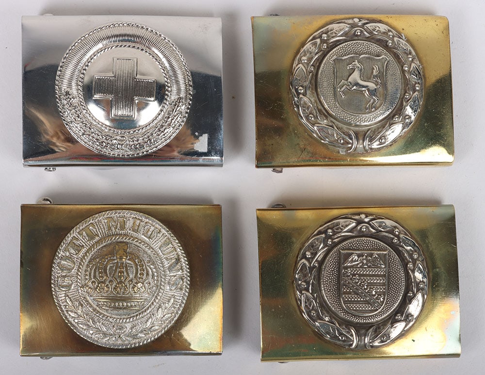 German Belt Buckles: German Belt Buckles: White metal Red Cross buckle, two Fire service buckles with towns crest to centre and later WW1 buckle. 4 items