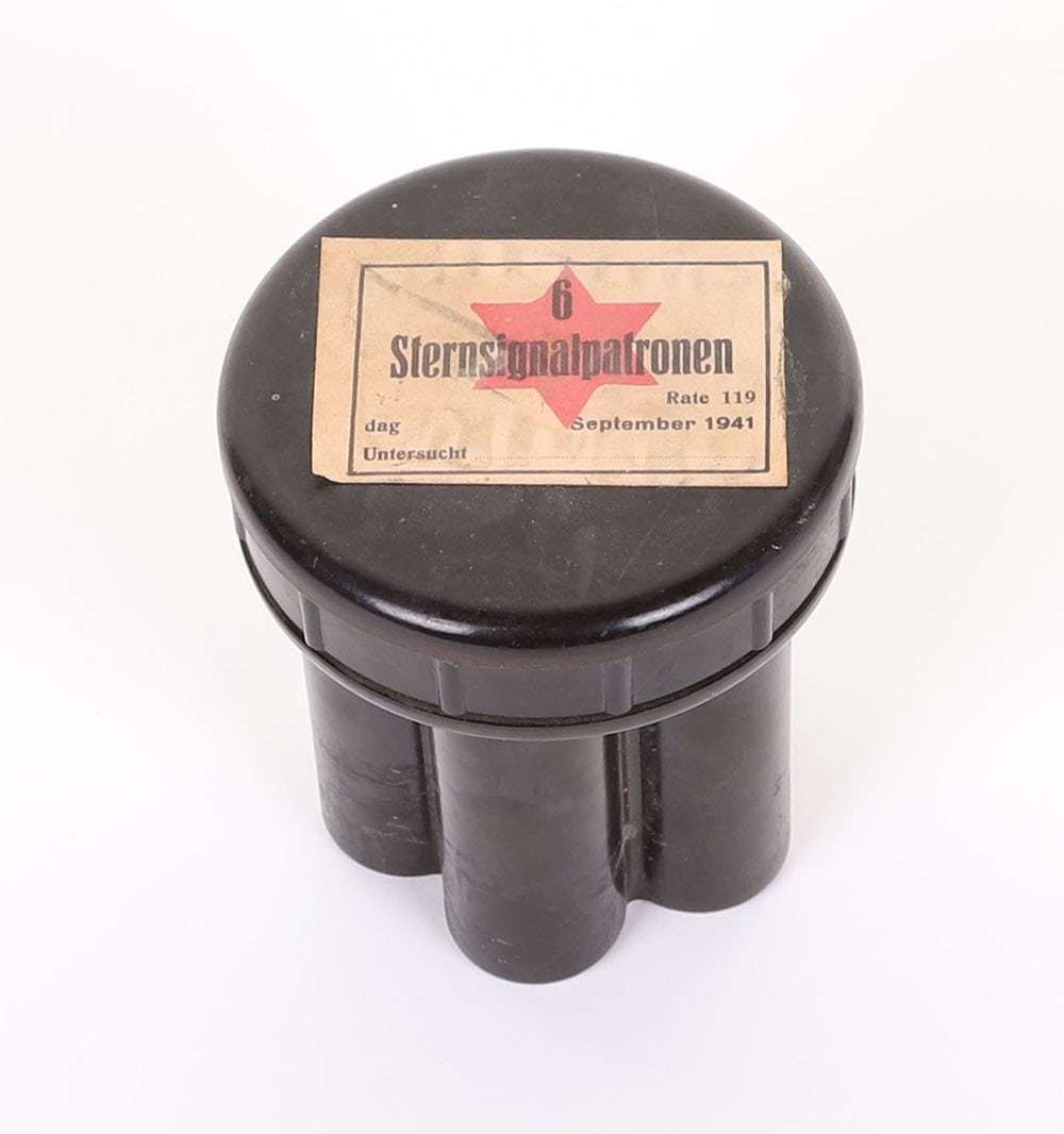 WW2 German Signal Gun Cartridge Case: WW2 German Signal Gun Cartridge Case, bakelite case with un-screwable lid, the lid with paper label dated 1941.