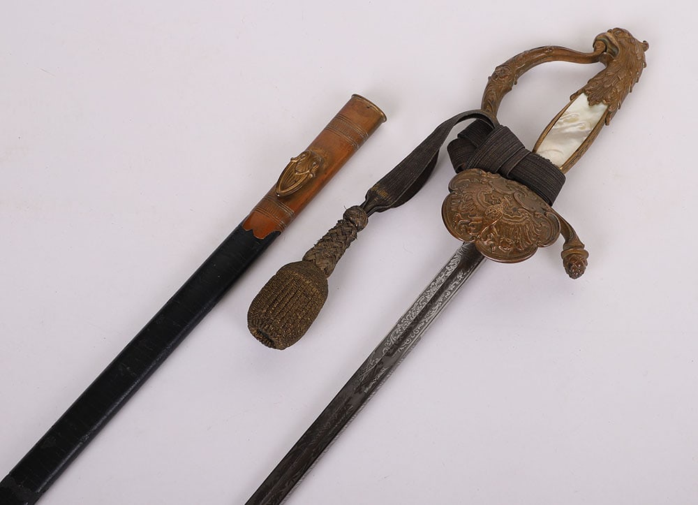 Imperial German Diplomatic Officials Dress Sword: Imperial German Diplomatic Officials Dress Sword, fine example with gilt brass hilt in the form of an eagle, mother of pearl grip, knuckle guard with relief, shell guard with relief of Imperial German