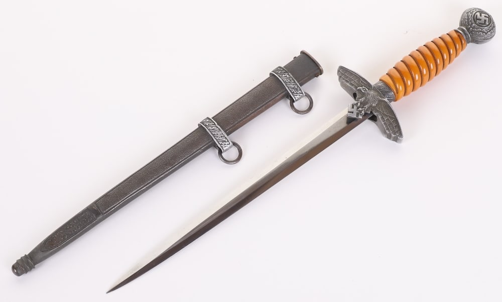 WW2 German Luftwaffe 2nd Pattern Dress Dagger by Gustav Spitzer, Solingen: WW2 German Luftwaffe 2nd Pattern Dress Dagger by Gustav Spitzer, Solingen, with orange celluloid grip having the wire binding. Cross guard in form of Luftwaffe eagle in flight. Swastikas to the centre