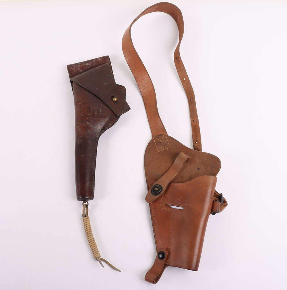 Two US Army Leather Pistol Holsters: Two US Army Leather Pistol Holsters, Two US Army leather holsters, one or the 38 revolver dating to 1909 and made by ‘Rock Island Arsenal’. Its leather in a dark brown is supple but sturdy